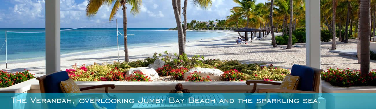 The Verandah overlooking Jumby Bay Beach and the sparkling sea.